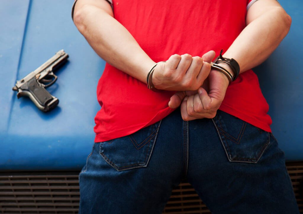 detained criminal in handcuffs